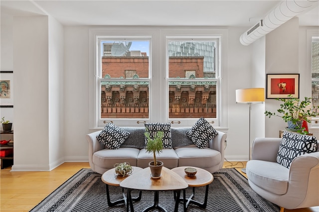 living room with light hardwood / wood-style flooring