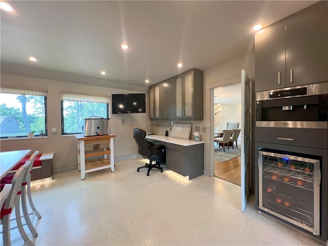 office area featuring wine cooler, baseboards, and recessed lighting