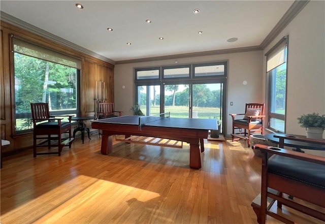 game room featuring recessed lighting, crown molding, and wood finished floors