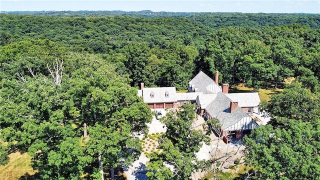 drone / aerial view featuring a forest view