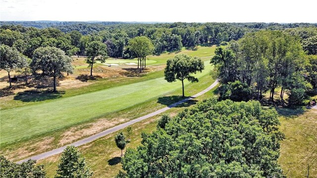 bird's eye view featuring a wooded view