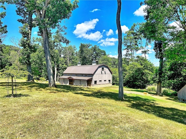 view of yard with a barn and an outdoor structure