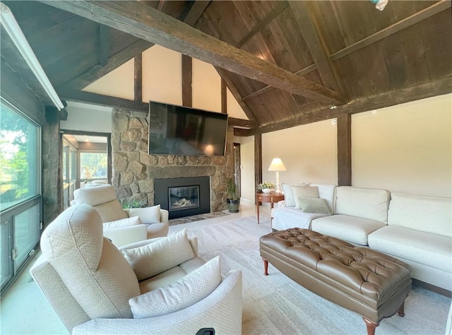 living area featuring wooden ceiling, a fireplace, high vaulted ceiling, and beamed ceiling