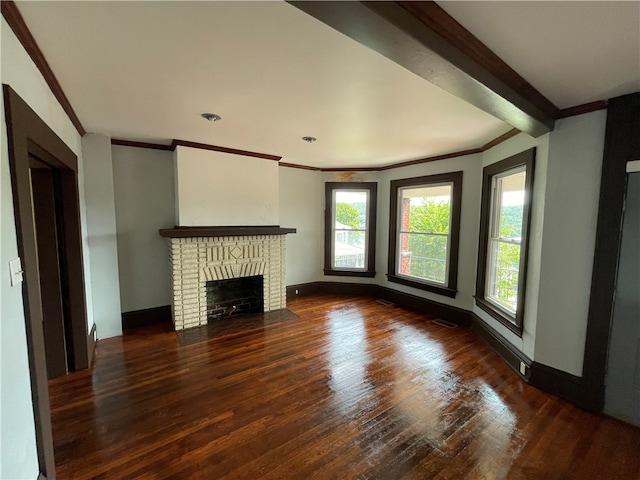 unfurnished living room featuring crown molding, a brick fireplace, and hardwood / wood-style floors