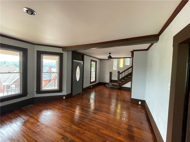 interior space featuring ornamental molding, ceiling fan, and dark wood-type flooring