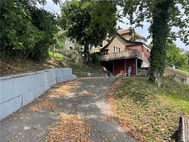 view of front of home with a wooden deck