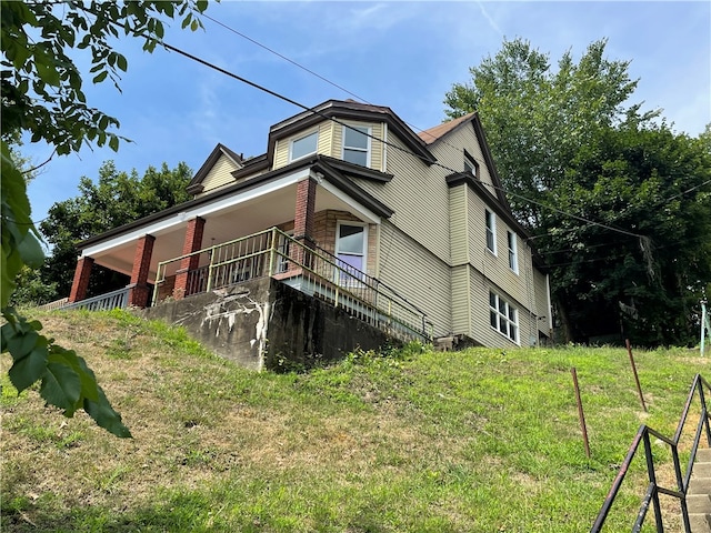 view of property exterior with a lawn