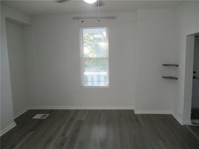 unfurnished room featuring dark hardwood / wood-style floors