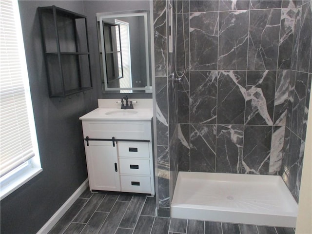 2551 Woodward Ave, Brookline, PA 15226 - bathroom with vanity, healthy amount of natural light, a shower stall, and baseboards