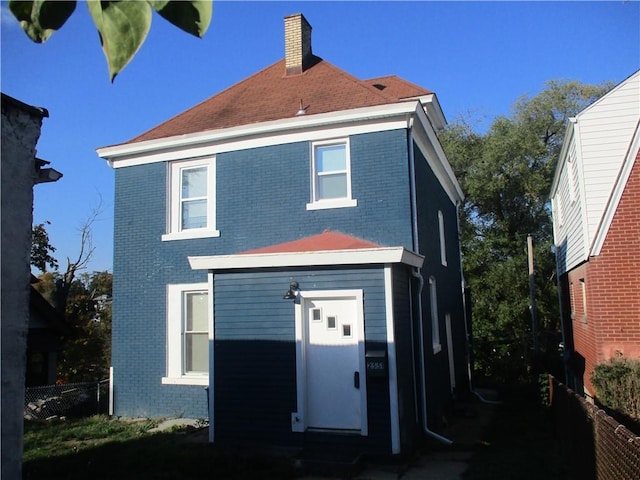 2551 Woodward Ave, Brookline, PA 15226 - back of house featuring brick siding, a chimney, and fence