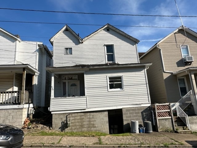 back of house with a porch