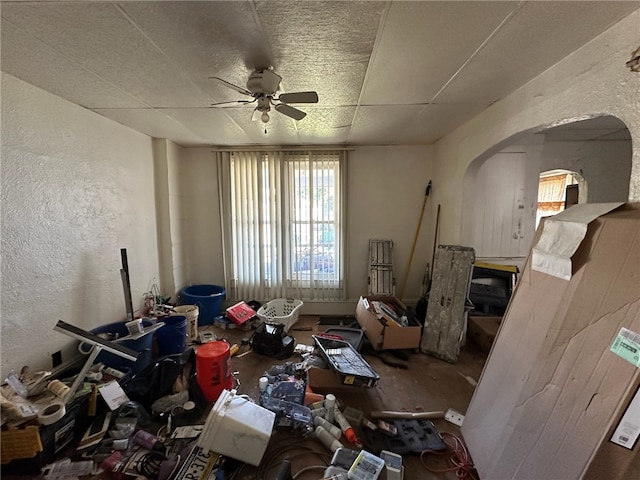 miscellaneous room with ceiling fan and a paneled ceiling