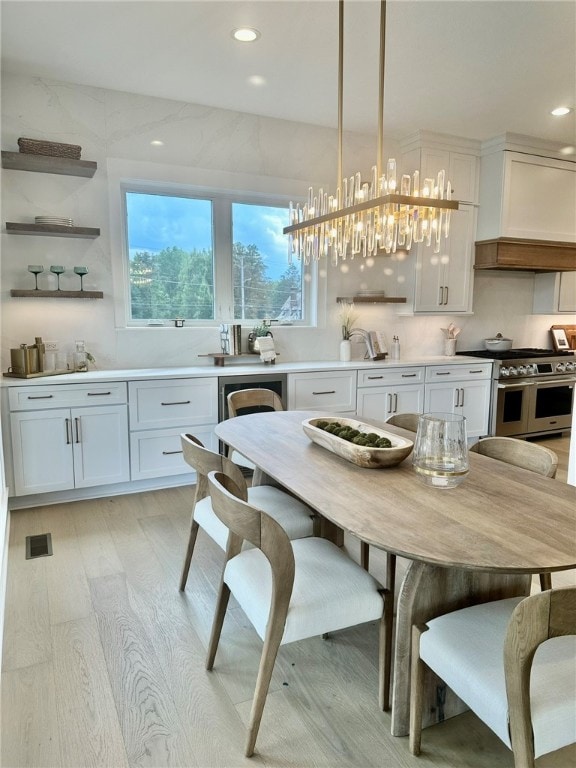 dining space with light hardwood / wood-style flooring