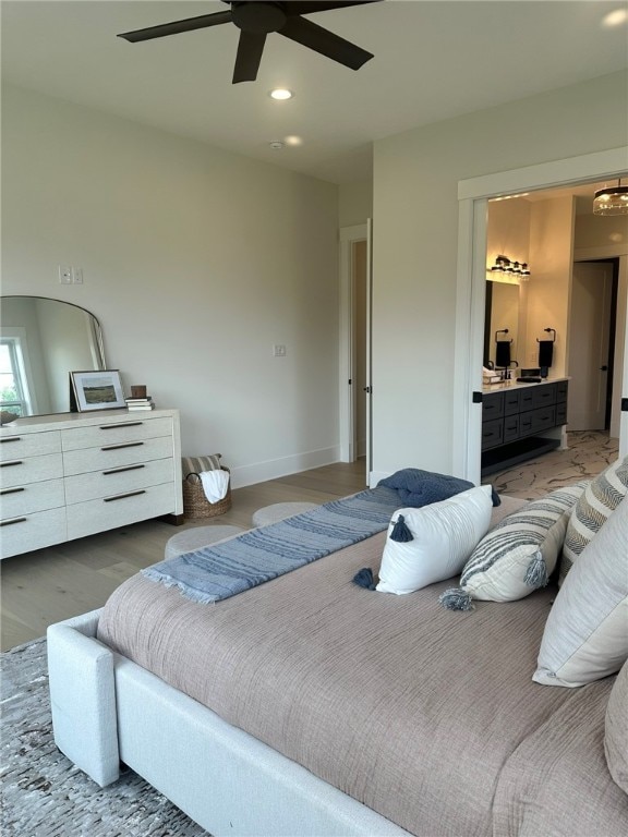 bedroom with hardwood / wood-style floors and ceiling fan