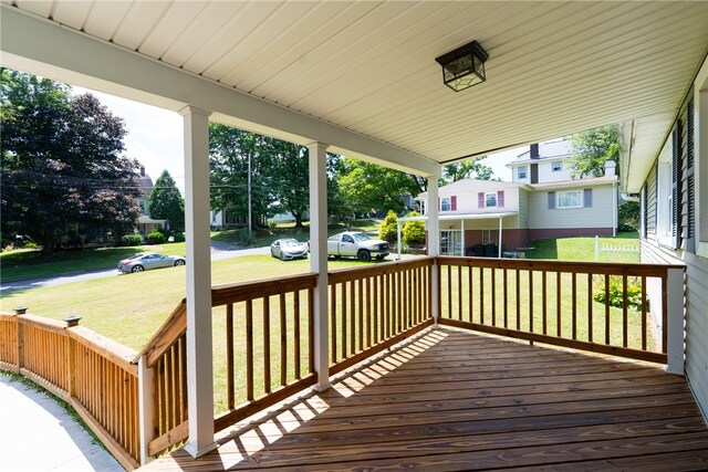 wooden terrace with a yard