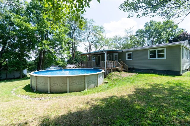 view of yard with a swimming pool side deck