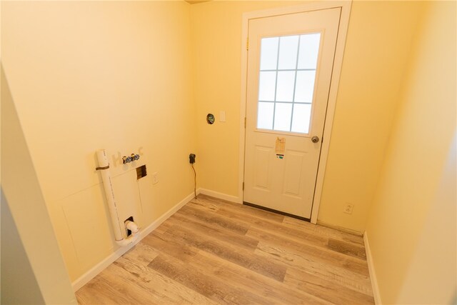 doorway to outside with light hardwood / wood-style floors