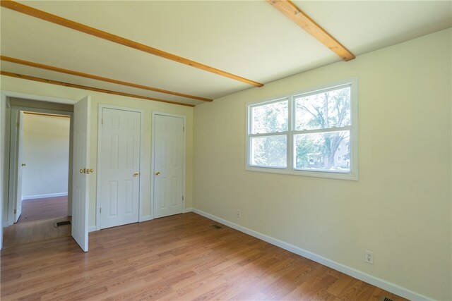 unfurnished bedroom with light hardwood / wood-style floors