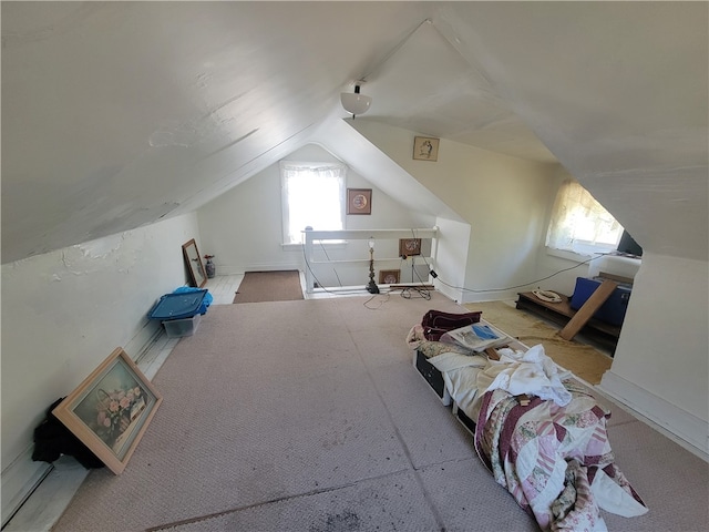 bonus room with carpet flooring and lofted ceiling