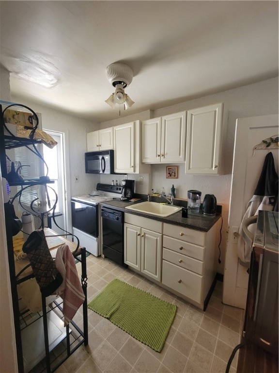 kitchen with light tile patterned floors, dishwasher, white range oven, ceiling fan, and sink