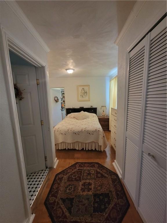 3110 Brentwood Ave, Brentwood, PA 15227 - bedroom featuring wood finished floors, a closet, and crown molding