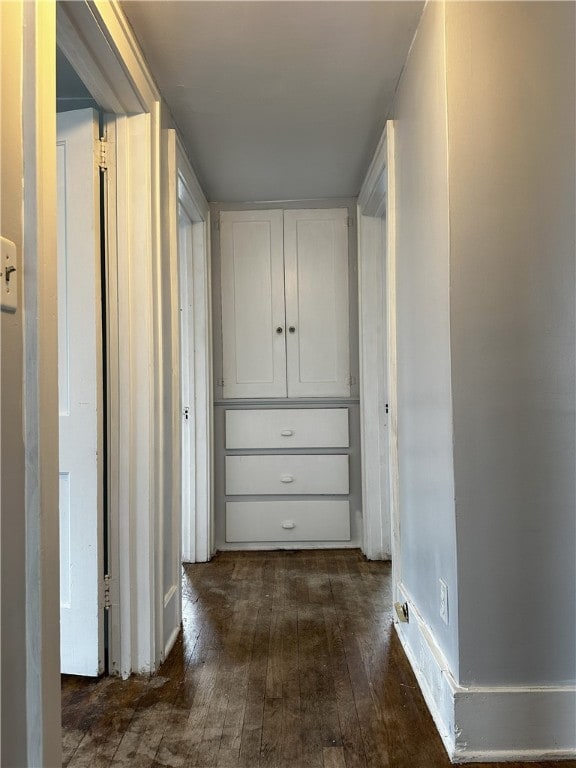 hallway featuring dark hardwood / wood-style floors