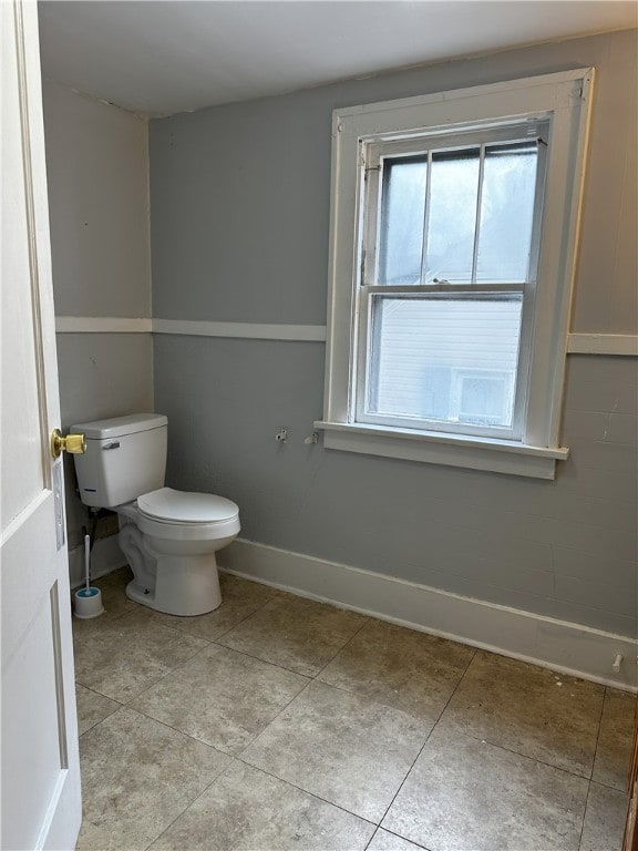 bathroom with tile patterned floors and toilet