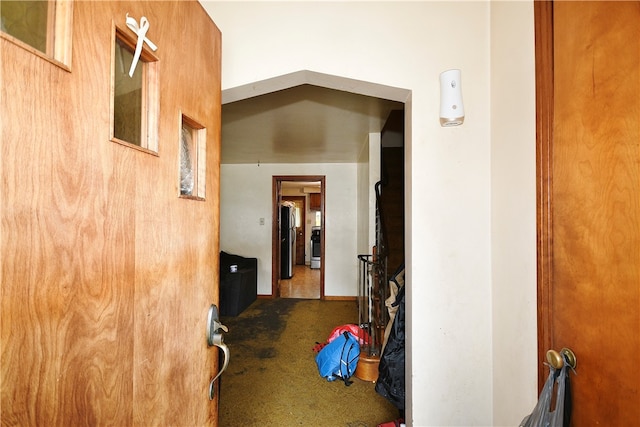 hallway with tile patterned flooring