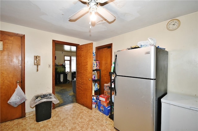 kitchen with stainless steel fridge, light tile patterned floors, and ceiling fan