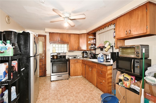 kitchen with ceiling fan, black appliances, and light tile patterned floors