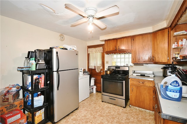 kitchen featuring ceiling fan, stainless steel appliances, and light tile patterned floors