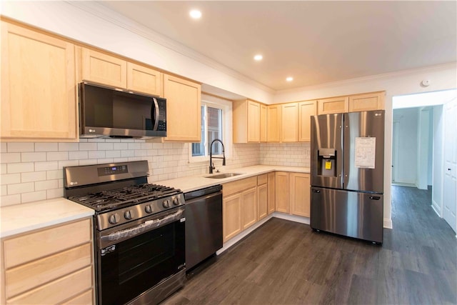 kitchen with light brown cabinetry, appliances with stainless steel finishes, and dark wood-type flooring