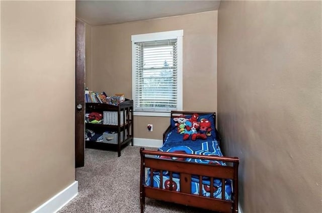 bedroom featuring carpet floors and baseboards