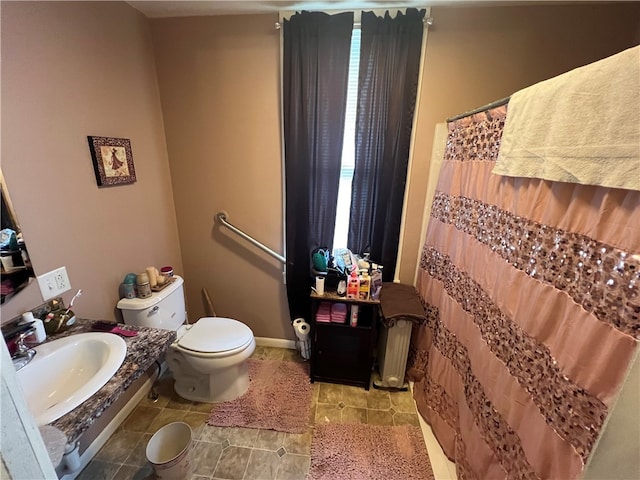 bathroom with toilet and sink