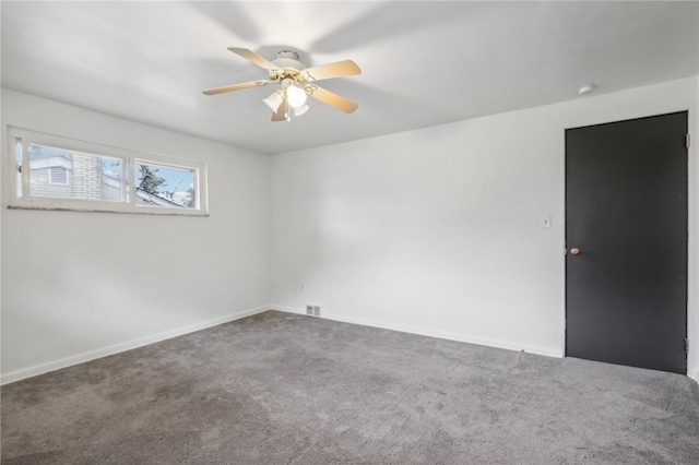 carpeted empty room with ceiling fan