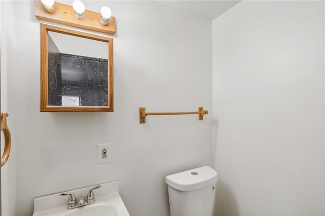 bathroom with sink and toilet