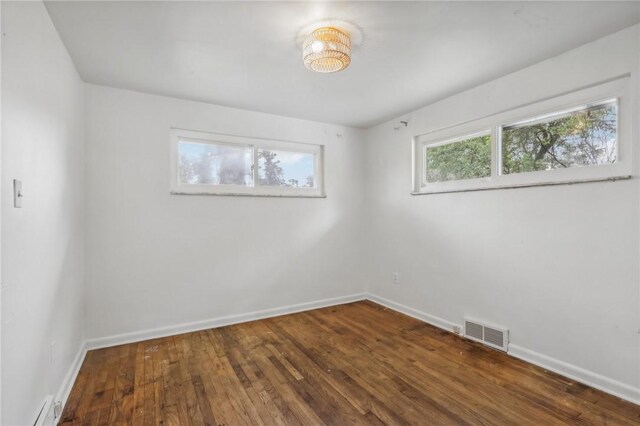 spare room featuring hardwood / wood-style floors