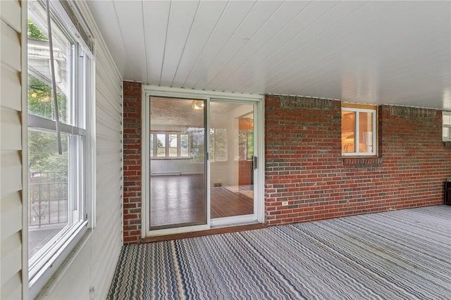 unfurnished sunroom with a wealth of natural light