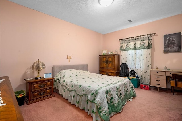 carpeted bedroom with a textured ceiling