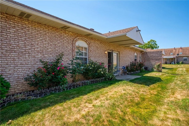 entrance to property with a yard