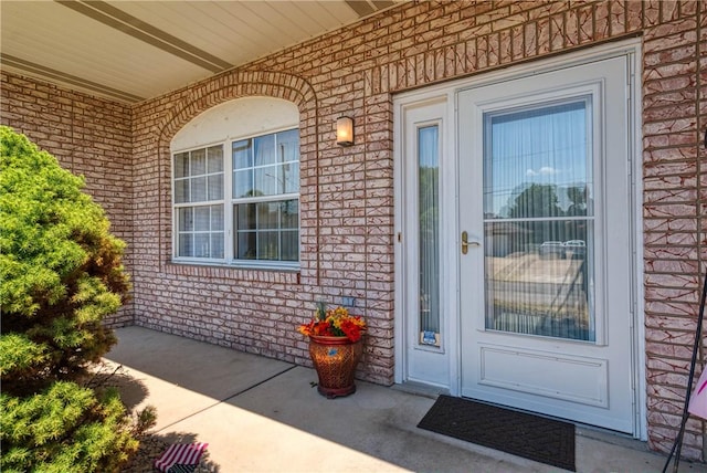 entrance to property featuring a patio