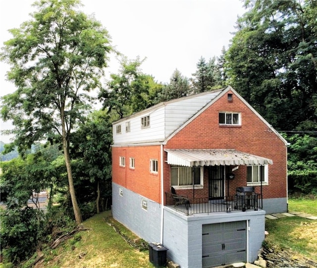 view of front of house featuring a garage and cooling unit