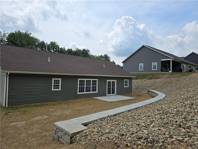 rear view of property featuring a patio area