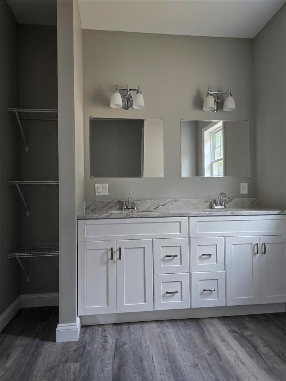 bathroom with vanity and hardwood / wood-style floors