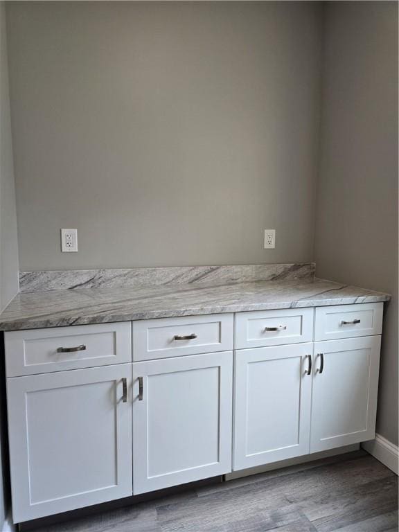 interior details with hardwood / wood-style flooring