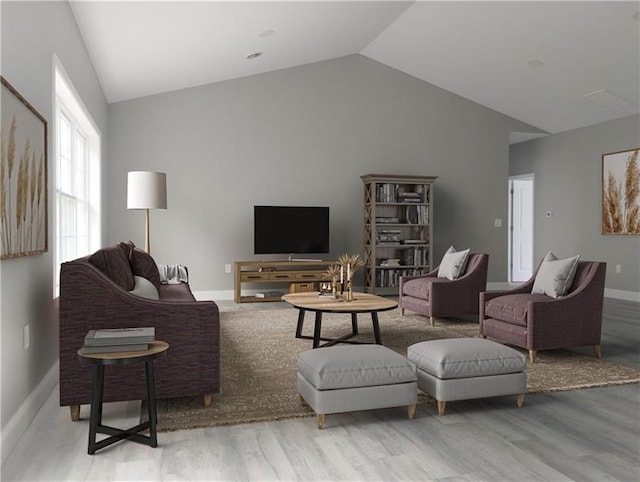 living room featuring high vaulted ceiling and light hardwood / wood-style floors