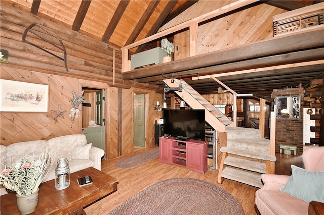 living room with high vaulted ceiling, wooden walls, hardwood / wood-style floors, and wood ceiling