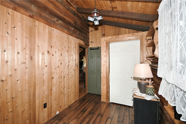 interior space featuring dark wood-type flooring, wooden ceiling, and lofted ceiling with beams