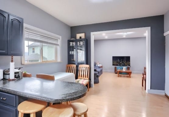 dining space featuring light wood-type flooring