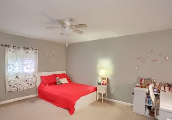 carpeted bedroom featuring ceiling fan